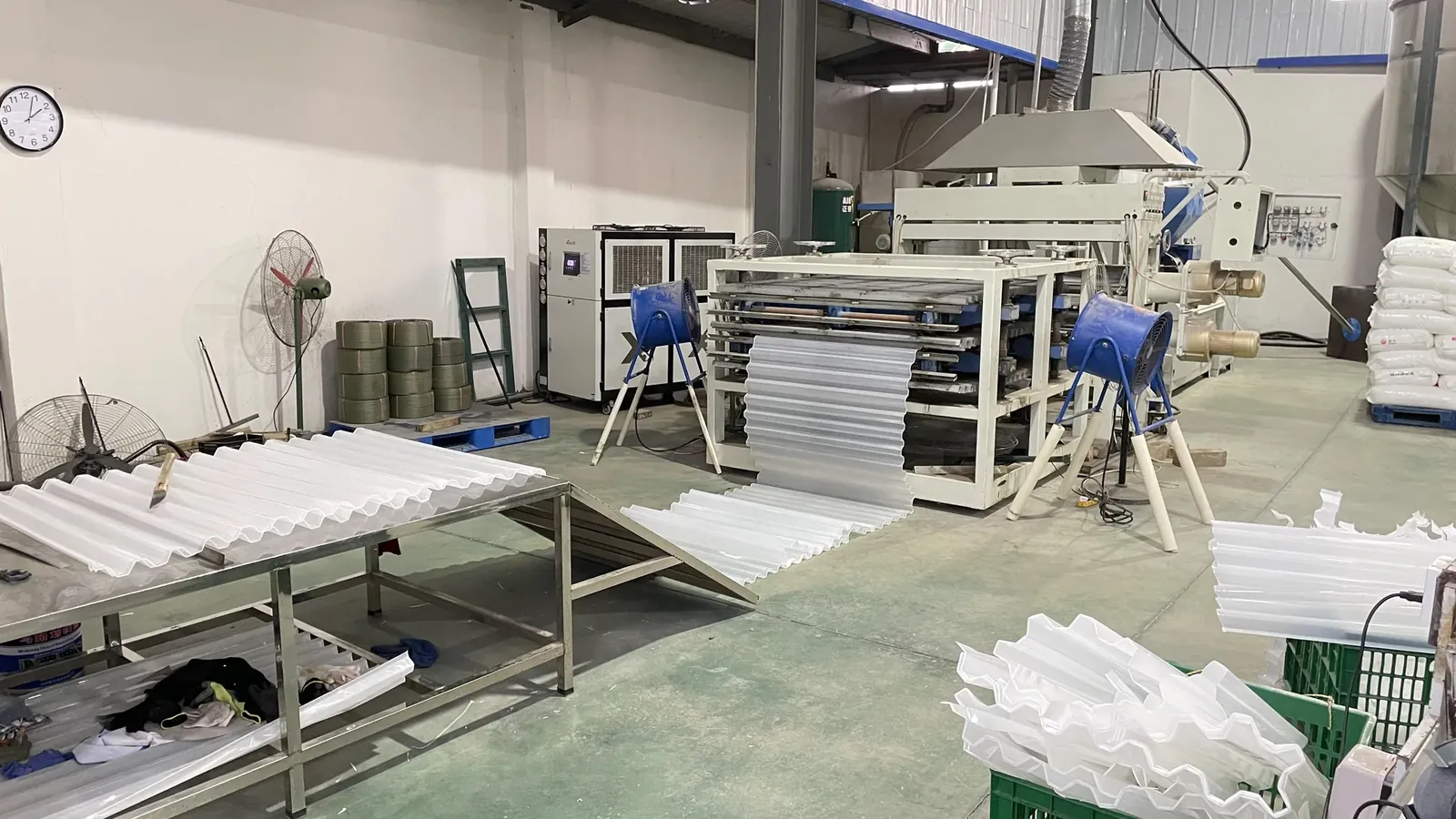 Plastic sheet forming equipment in the workshop